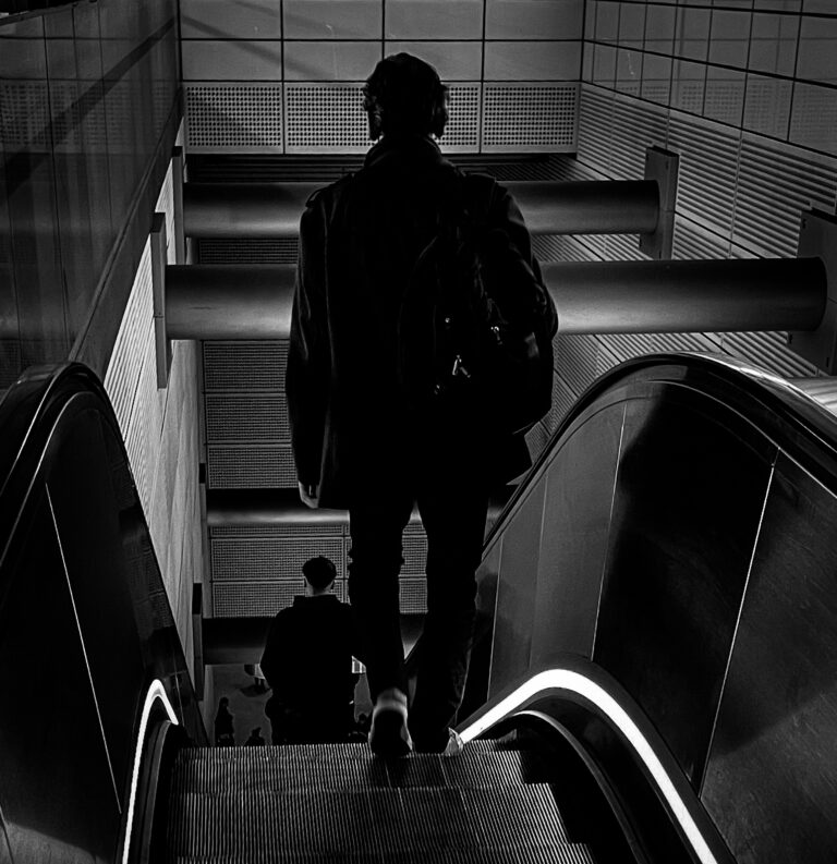 Man on escalator 